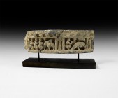 Gandharan Figural Frieze Section with Figures and Animals
2nd-4th century AD. A carved schist frieze fragment, slightly curved in plan, with crenella...