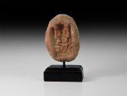 Gandharan Mould with Enthroned Figure
2nd-4th century AD. A terracotta mould representing a facing figure seated on a throne with flanking pillars, t...