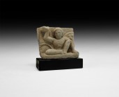 Gandharan Figural Frieze Section with Crouching Atlas
2nd-4th century AD. A schist frieze fragment with high-relief figure of Atlas crouching on a ba...