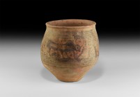 Indus Valley Vessel with Zebu
3rd-2nd millennium BC. A large ceramic bulbous vessel with everted rim, circumferential bands below the neck and to the...