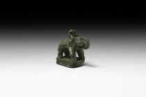 Indian Elephant Statuette
1st millennium AD. A bronze model elephant on a stepped rectangular base hollow to the underside; standing with trunk recur...