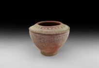 Large Indus Valley Storage Vessel
2nd-1st millennium BC. A large ceramic jar with socle base, conical body with piecrust rim, domed shoulder with rai...