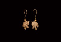 Indian Bone Elephant and Gold Earring Pair
19th century AD. A matching pair of gold earrings with hook attachment, the breloque formed as a carved bo...