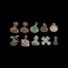 Indus Valley Stamp Seal Group
Late 3rd-2nd millennium BC. A mixed group of ten bronze seals of various shapes and designs, including seven accompanie...