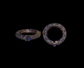 Islamic Enamelled Bracelet
19th-20th century AD. An annular copper-alloy bracelet with hinged closure, enamelled surface with reserved floral detaili...
