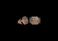Islamic Gilt Silver Ring with Beast
18th century AD. A silver ring comprising a facetted hoop with running waves to the underside, regardant beast am...