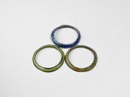 Islamic Polychrome Glass Bracelet Group
6th-8th century AD. A mixed group comprising: a deep blue glass bangle of triangular section with applied bla...