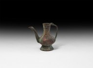 Islamic Handled Jug
18th-19th century AD. A sheet bronze miniature ewer with squat body, flared base, curved spout, hinged strap handle to the neck. ...