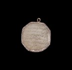 Islamic Silver Pendant with Calligraphic Tablet
19th century AD. A silver hexagonal pendant with interlaced wire to the edge; set with a hexagonal ag...
