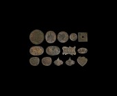 Islamic Stamp Plate Group
20th century AD. A mixed group of fourteen brass plates in various shapes, each with calligraphic text and other embellishm...