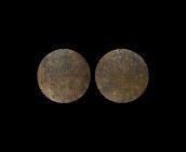 Islamic Magical Fortune Telling Disc
20th century AD. A bronze bifacial astrolabe disc with bands of text and numeric grid to one face, segmented cir...