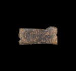 Islamic Inscribed Order Amulet
8th-9th century AD. A bronze rectangular order with notched ends and lug to one edge, punched-point two-line inscripti...