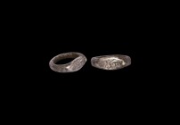 Timurid Silver Inscribed Ring
13th-14th century AD. A silver ring comprising a D-section hoop, flat ellipsoid bezel with incised text, stud to one en...