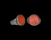 Islamic Timurid Silver Ring with Calligraphic Gemstone
14th century AD. A silver finger ring comprising a convex hoop, drum-shaped bezel with hatchin...