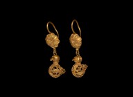 Islamic Gold Filigree Bird Earring Pair
12th-13th century AD. A matched pair of gold filigree birds, each suspended from a later earring hook with fi...