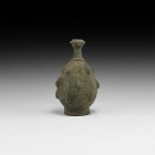 Islamic Teardrop Vessel
13th-14th century AD. A bronze piriform vessel with discoid base, raised ropework collar, narrow neck and mouth with seven ra...