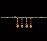Islamic Glass Bead Necklace with Gold Pendants
19th century AD and earlier. A restrung necklace of cylindrical drawn glass beads, with four later hol...