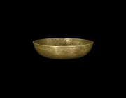 Islamic Decorated Bowl
14th-15th century AD. A broad, shallow copper-alloy bowl with flat rim, concentric bands of hatched and guilloche decoration t...