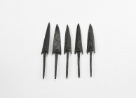 Greek Arrowhead Group
5th-3rd century AD. A group of five bronze arrowheads, all barbed with raised median ridge and long tang. 90.6 grams total, 10....