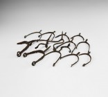 Medieval Prick Spur Collection
12th-14th century AD. A mixed group of iron prick spurs, mainly with straight flat-section arms and pierced lobed fini...