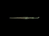 Western Asiatic Elamite Spearhead with Decorated Shaft
2nd millennium BC. A bronze spearhead with triangular blade, stepped midrib, twisted neck, squ...