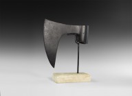 Large Medieval Point-Bearded Axehead
12th-15th century AD. A substantial iron axe-head with round-section socket, broad bearded blade with curved edg...