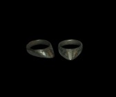Medieval Archer's Ring
13th-15th century AD. A bronze archer's ring with flat-section hoop, triangular flange extension decorated with hatched line b...