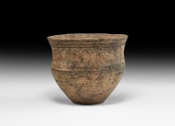Neolithic Decorated Vessel
3rd millennium BC. A ceramic cup of biconvex profile with flared rim, bands of impressed pointillé and other detailing to ...