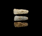 Neolithic Polished Axehead Group
5th-2nd millennium BC. A group of three knapped and polished stone axeheads with narrow butts and curved edges. 389 ...