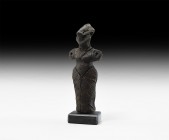 Vin?a Standing Idol
Neolithic, 6th-4th millennium BC. A ceramic figurine of a standing female with triangular headdress, stub arms extended laterally...