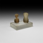 Anatolian Alabaster Idol Group
3rd millennium BC. A pair of carved alabaster idols comprising: one with D-shaped base, tapering shank and discoid hea...