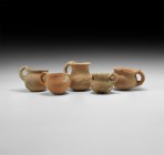 Bronze Age Holy Land Dipper Cup Collection
3rd-2nd millennium BC. A group of five terracotta cups, each with bulbous body, flared rim and loop handle...