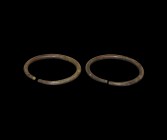 Bronze Age Arm Ring Pair
2nd millennium BC. A matched pair of round-section bronze arm-rings with butted ends. 344 grams, 12-12.3cm (4 3/4"). Propert...