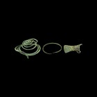 Bronze Age Artefact Group
3rd-2nd millennium BC. A group of bronze artefacts comprising: a round-section neck torc with tapering finials; a lozenge-s...
