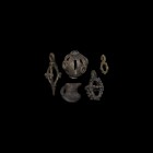 Bronze Age Pendant Group
2nd millennium BC. A mixed group of bronze amuletic pendants including a miniature pitcher, three spherical cages with lobe ...
