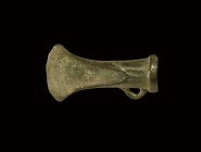 Bronze Age Looped and Socketted Axehead
2nd millennium BC. A small socketted axehead with ribbed collar to the mouth, flared blade with convex cuttin...