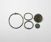 Bronze Age Artefact Collection
Mainly 2nd millennium BC. A mixed group of bronze items comprising: three round-section bracelets with hook-and-eye cl...