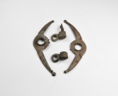 Iron Age Celtic Chariot Fitting Group
2nd century BC-1st century AD. A group of harness fittings for a chariot including two crescent bars each with ...