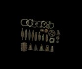 Iron Age Celtic Artefact Collection
3rd-1st century BC. A mixed group of bronze artefacts comprising: eight annular ring money with applied lobes; fi...