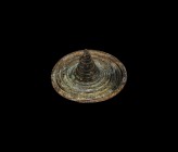 Iron Age Celtic Spiral Mount
1st millennium BC. A coiled bronze spiral rising to a conical point in the centre. 55 grams, 50mm (2"). Property of a Lo...