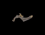 Romano-Celtic Gilt Silver Bow Brooch with Dove
1st-2nd century AD. A silver-gilt Wroxeter-type trumpet-derivative bow brooch with hooked and ribbed c...