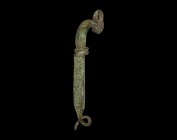 Iron Age Celtic Brooch with Inscription
5th-4th century BC. A bronze fibula body comprising a D-section plaque and bow, coiled finial with pierced lu...