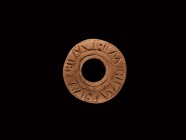 Anglo-Saxon Bone Spindle Whorl
8th-11th century AD. An annular bone spindle whorl with low-relief pseudo-runic markings. 3.03 grams, 24mm (1"). From ...