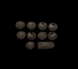 Viking Belt Mount Group
10th-11th century AD. A mixed group of bronze belt fittings with low-relief zoomorphic and tendril ornament. 61.3 grams total...