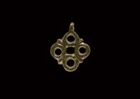 Viking Openwork Cross Pendant
9th-11th century AD. A bronze openwork pendant consisting of four roundels with a small leaf-decoration in-between, sus...