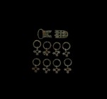 Viking Belt Mount Group
10th-11th century AD. A mixed group of bronze belt fittings including a buckle, tag and mounts with ring pendants. See Fodor,...