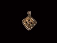 Viking Gilt Silver Pendant with Cross
9th-11th century AD. A silver-gilt pendant of lozengiform shape, raised pellet detailing to the edges, openwork...