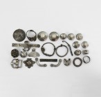Viking Silver Artefact Collection
10th-12th century AD. A mixed silver group comprising: two large and seven smaller bell-shaped belt studs; a belt b...