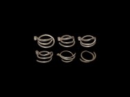 Viking Silver Hair Ring Collection
10th-12th century AD. A group of six silver hair rings, each a short coil of round-section rod with one returned e...