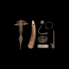 Anglo-Saxon Artefact Collection
5th-10th century AD. A mixed group comprising: a pierced antler toggle or pendant; a bronze pin with recurved finial;...